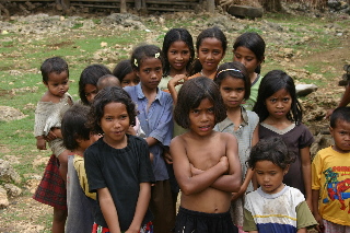 villagers feed the children